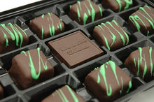 Chocolate Mint Fudg'ocolates in box.  Dark chocolate medallion inscribed with "waterloo candies" sits in centre of box